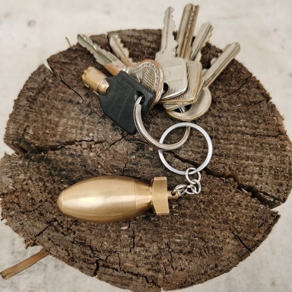 A Brass Bomb Shaped Medicine Bottle Keychain